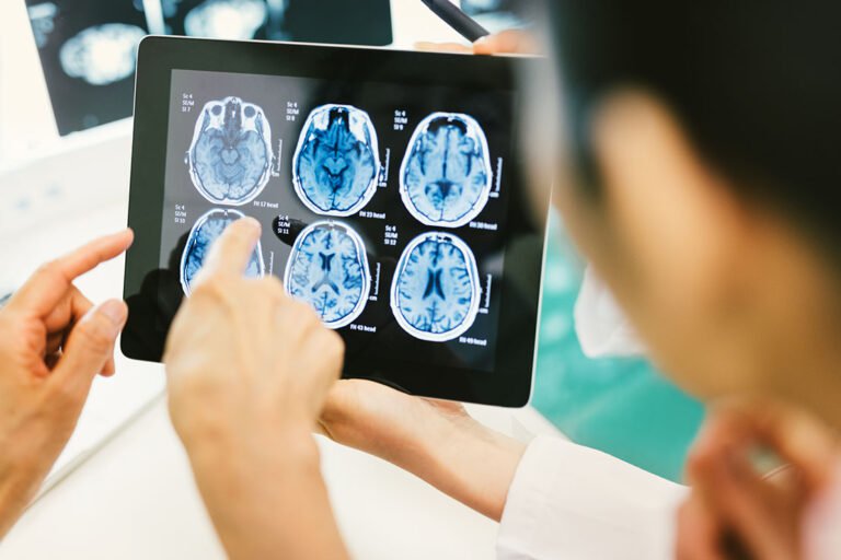 Doctor and patient engaging with a digital tablet, symbolizing the rise of Software as a Medical Device (SaMD) as a core enabler of intelligent, connected healthcare solutions.
