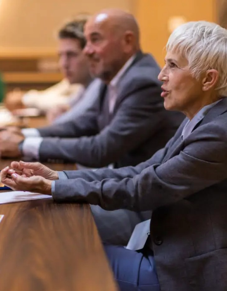 Regulators in a meeting, reflecting the financial industry's focus on resilience, compliance, and adapting to constant change through agile, transparent systems.