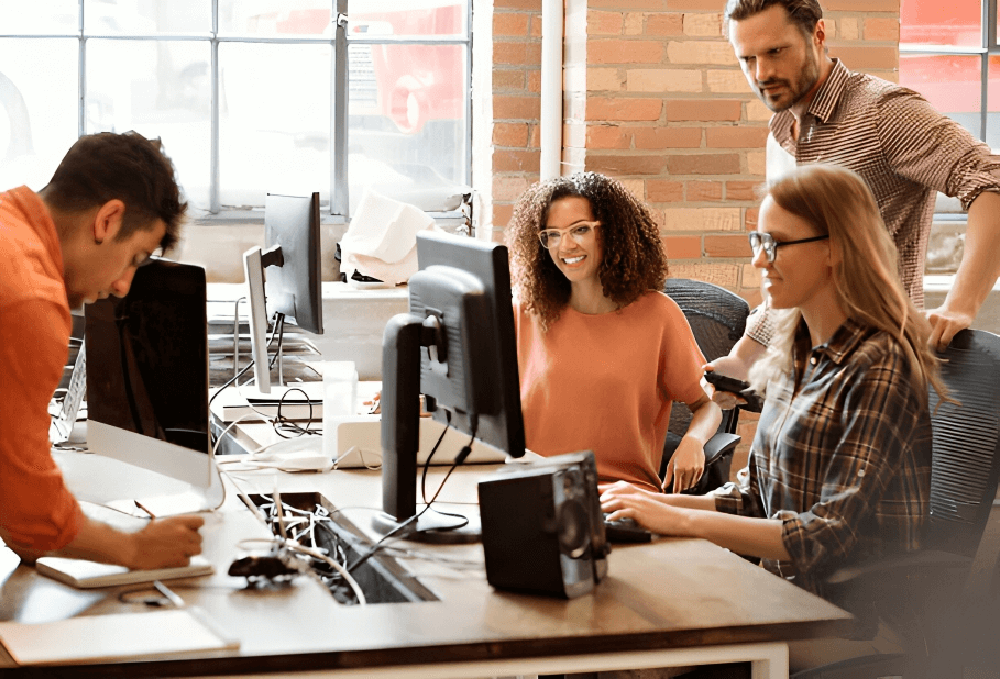 Software engineers collaborating on code, symbolizing AI-driven transformation in financial services.