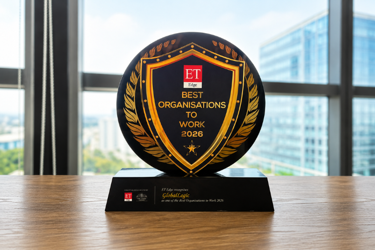 1 - GlobalLogic Round black and gold trophy with a laurel border reading 'Best Organisations to Work 2026' by ET Edge on a wooden table