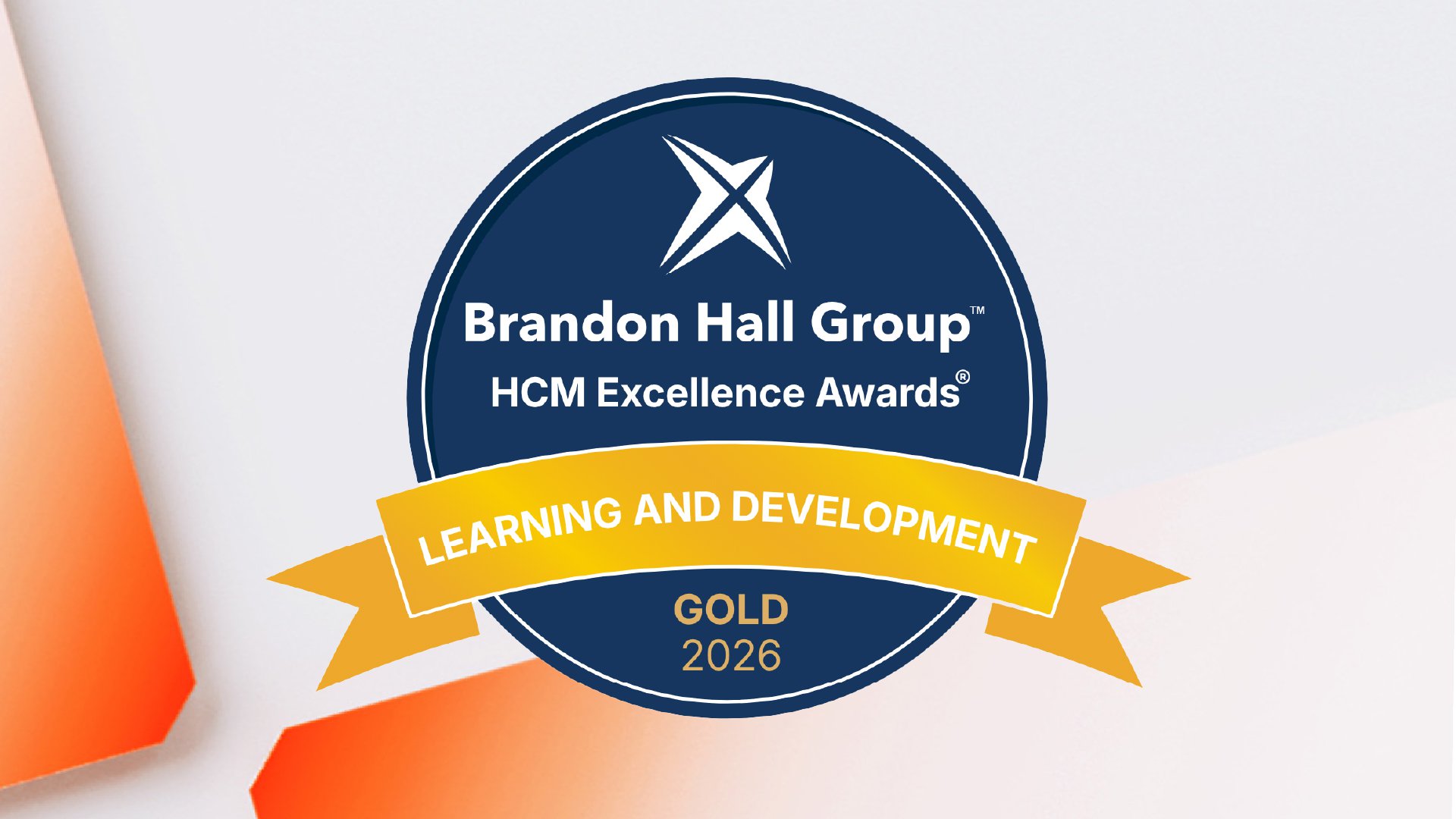 Brandon Hall Group HCM Excellence Awards badge on a navy circular seal with a gold ribbon reading GOLD 2026.
