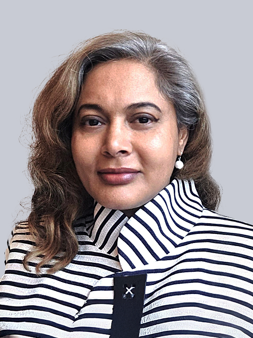 Portrait of a woman with shoulder-length hair wearing a black-and-white striped high-collar coat, looking at the camera with a neutral expression.